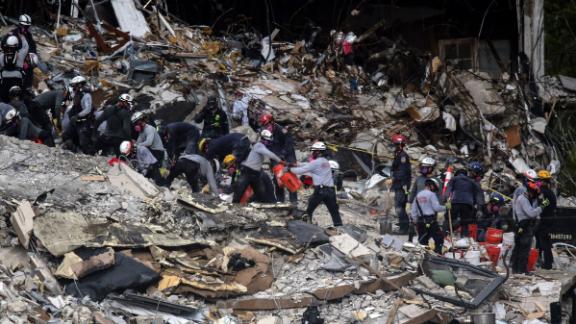 Search-and-rescue teams look through the rubble of Champlain Towers South on June 29.