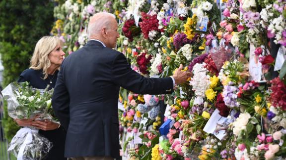 President Joe Biden and first lady Jill Biden visit a memorial near the partially collapsed building on July 1. <a href=