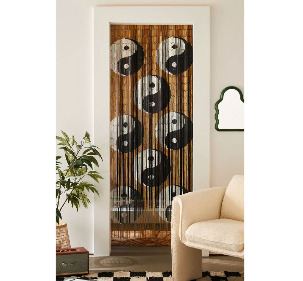Beaded curtains, like Urban Outfitters’ Yin Yang Bamboo Beaded Curtain, are back in style. (Courtesy of Urban Outfitters)